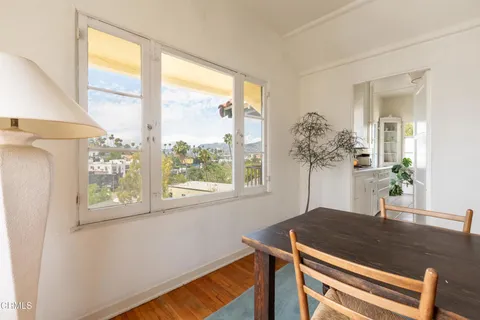 a kitchen with a sink cabinets and window