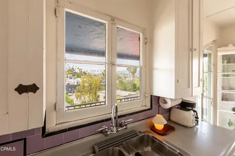 a kitchen with granite countertop cabinets and appliances