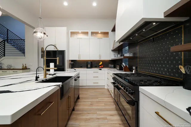 a kitchen with a stove and a sink