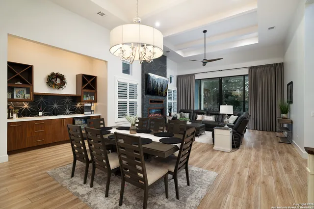 a view of a dining room with furniture window and wooden floor