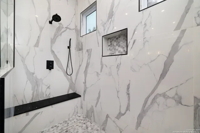 a picture of a bathroom with a shower