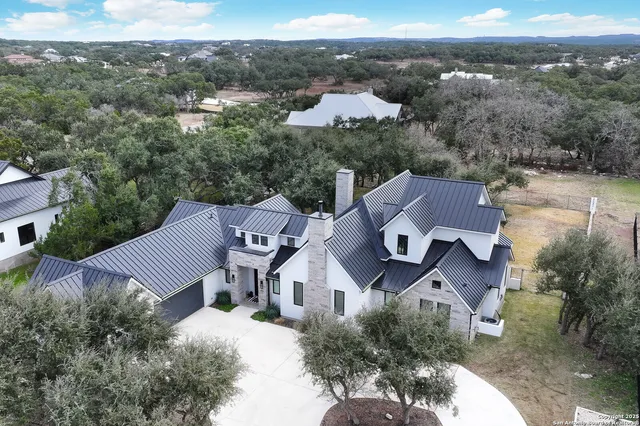 an aerial view of residential house and outdoor space
