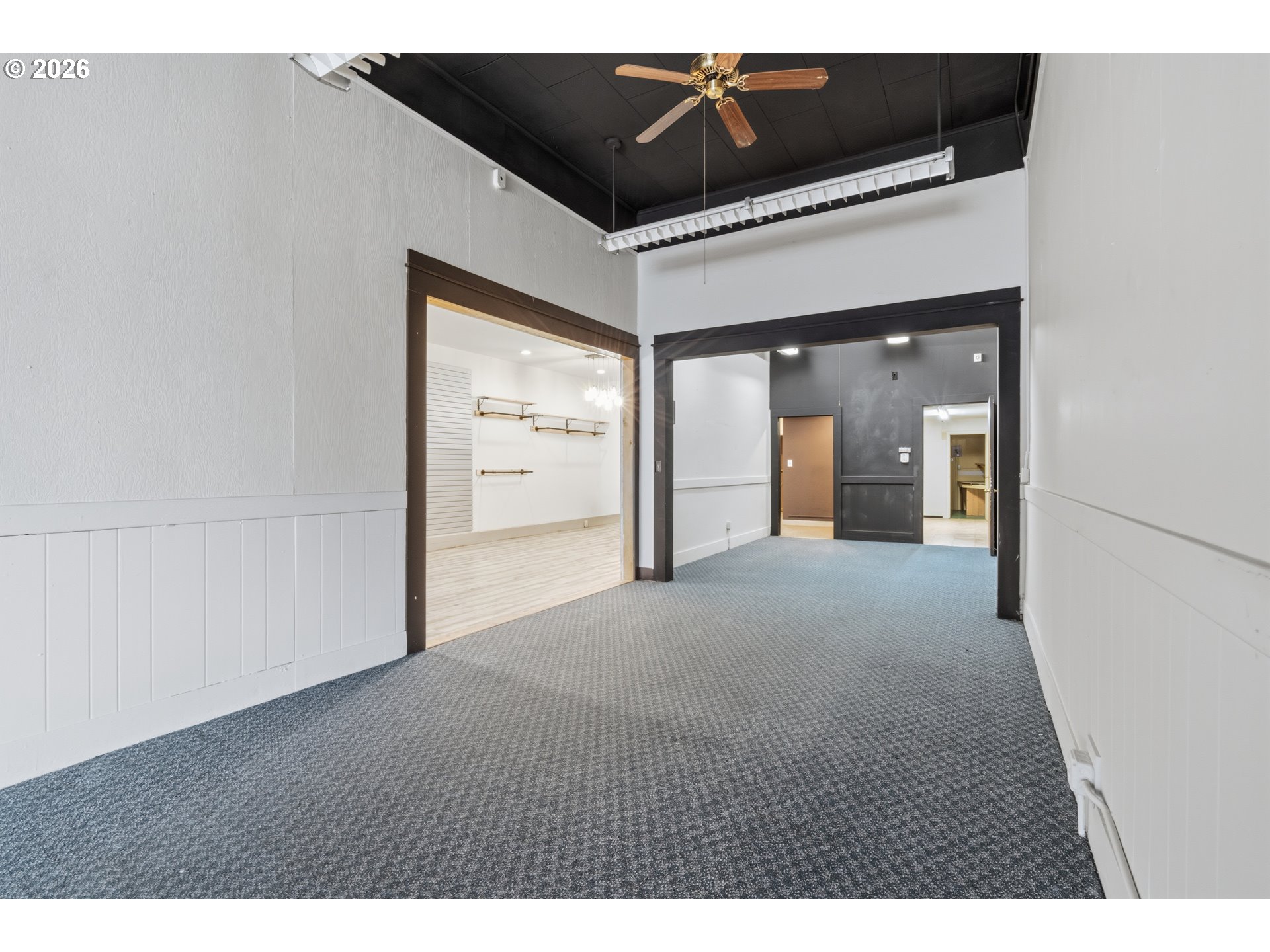 309 West 1st Avenue Albany, OR 97321 - Photo 11 of 39 a view of a room with a ceiling fan and wooden floor