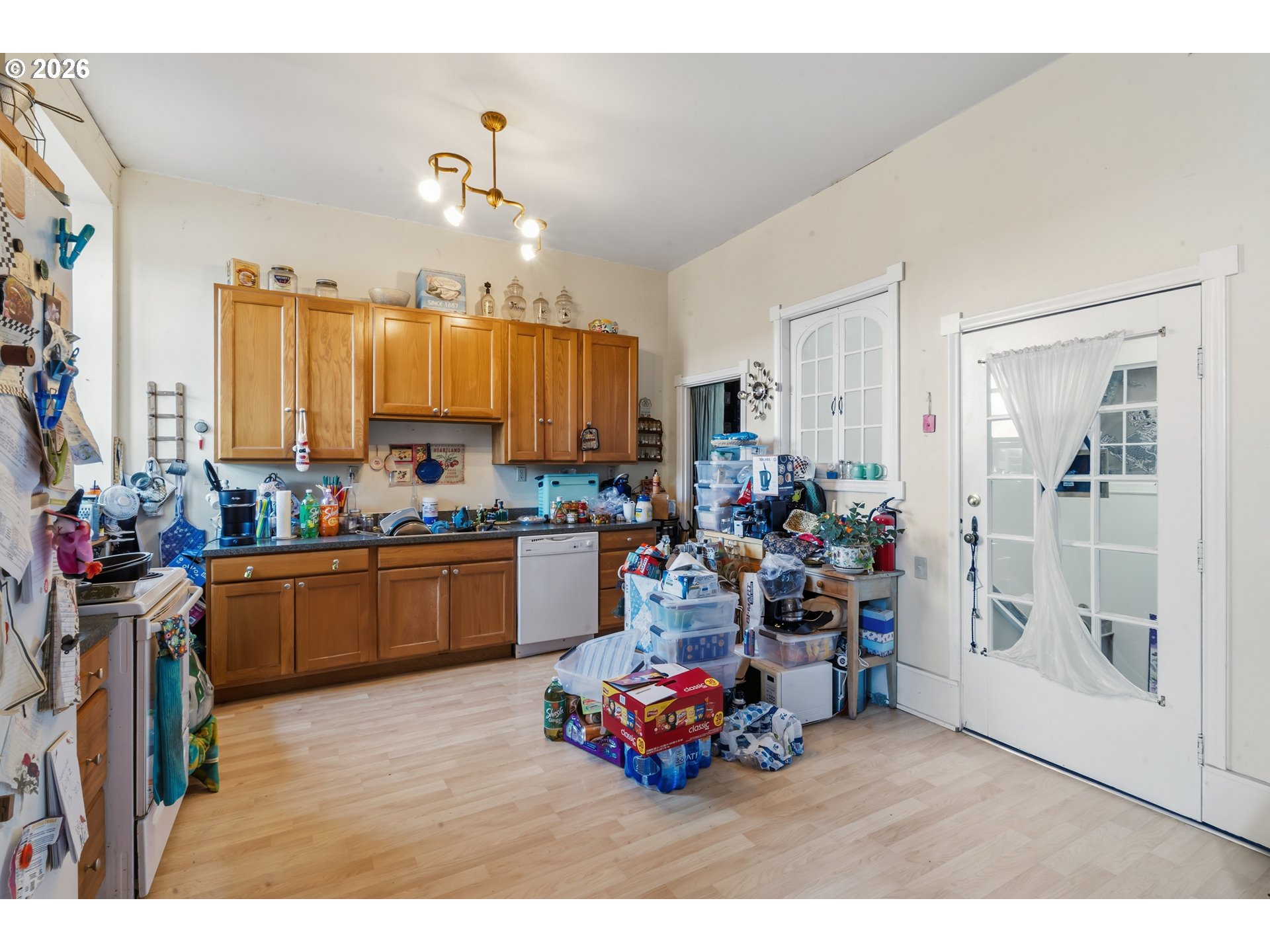 309 West 1st Avenue Albany, OR 97321 - Photo 17 of 39 a kitchen filled with a white cabinets and outdoor seating