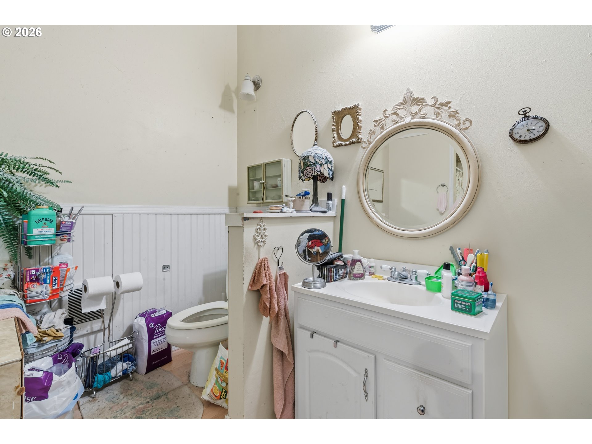 309 West 1st Avenue Albany, OR 97321 - Photo 26 of 39 a bathroom with a sink mirror vanity and toilet