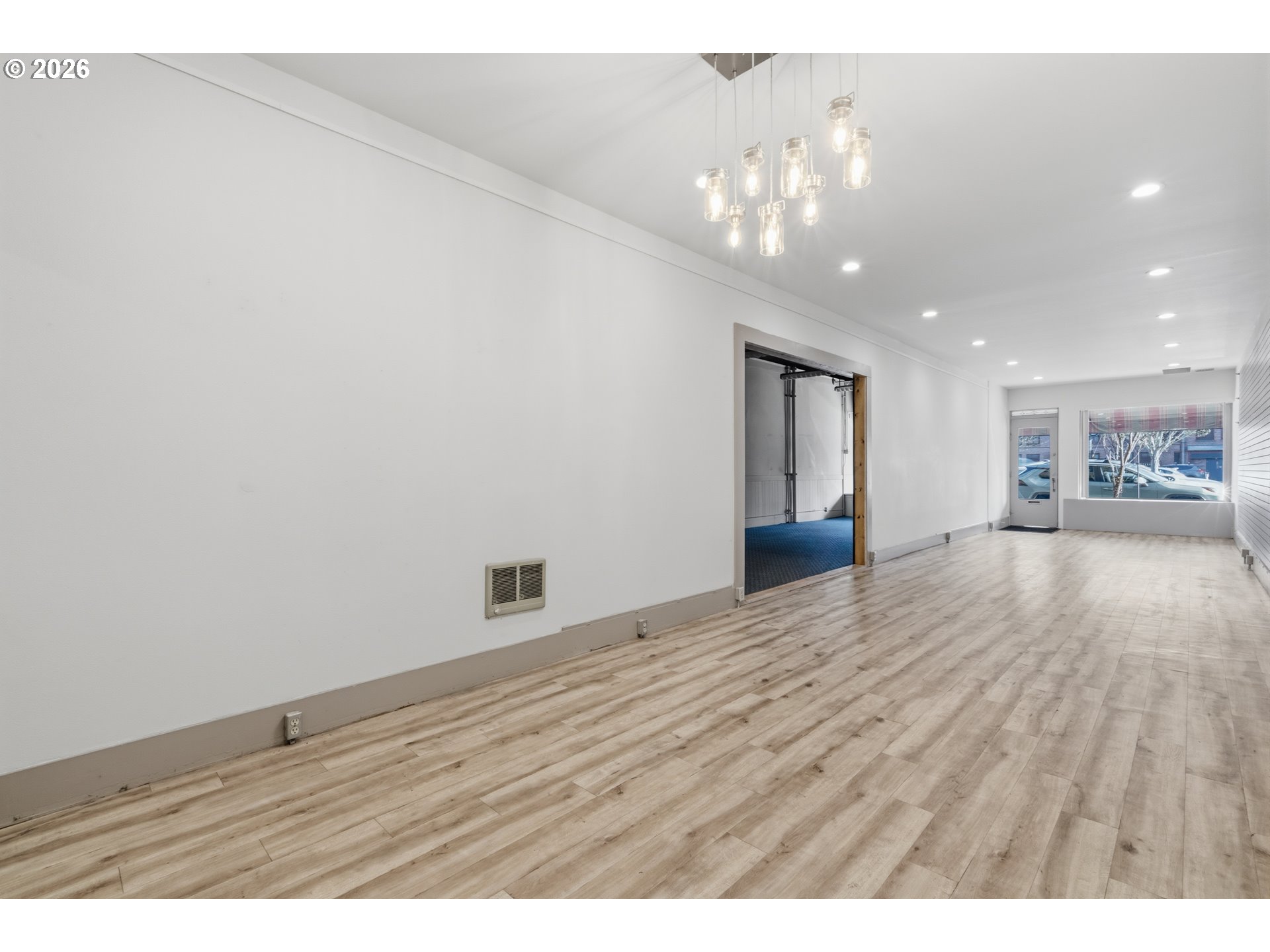 309 West 1st Avenue Albany, OR 97321 - Photo 8 of 39 a view of an empty room and wooden floor