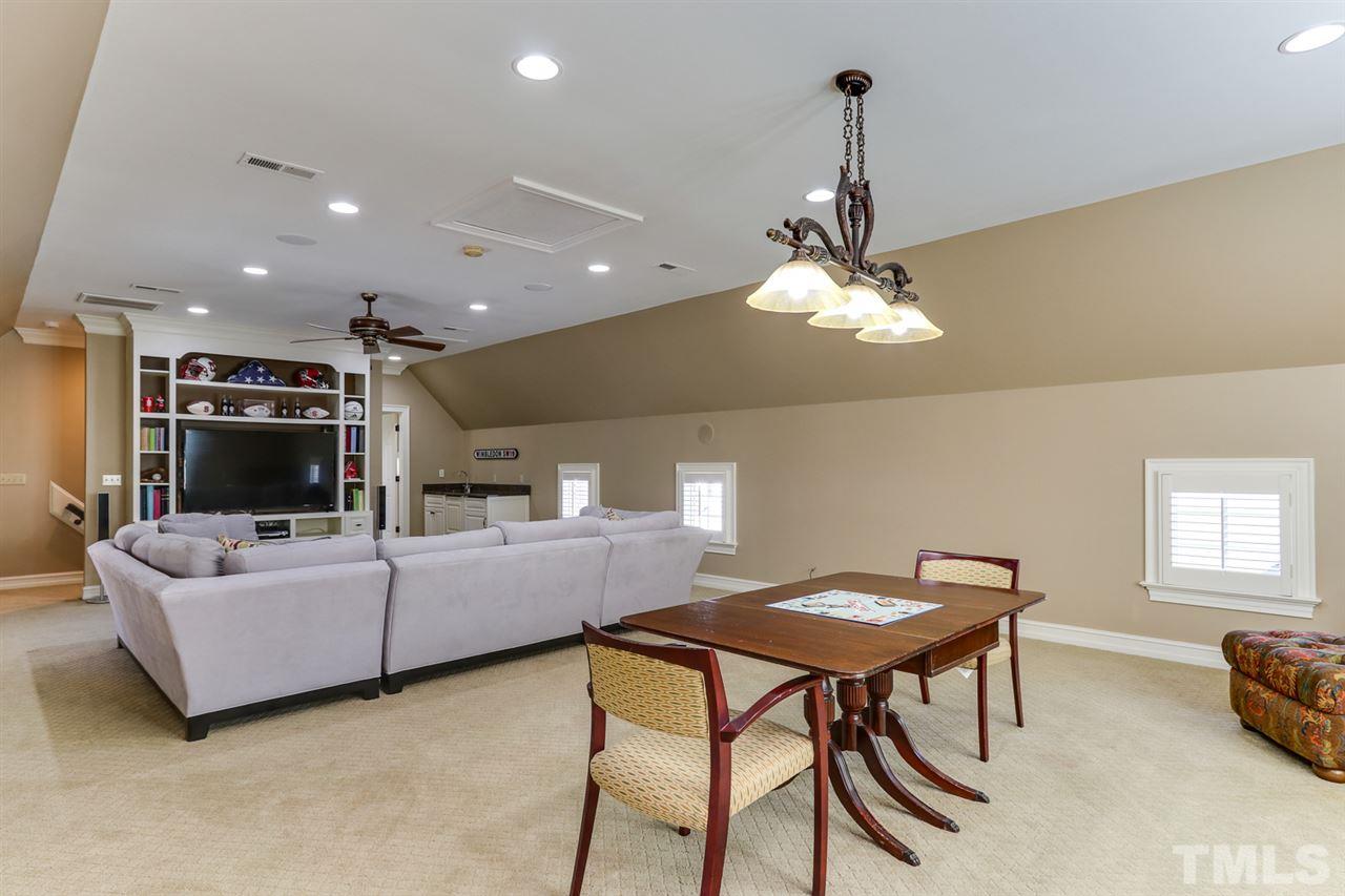 3329 Harden Road Raleigh, NC 27607 - Photo 20 of 29 a living room with furniture and a flat screen tv