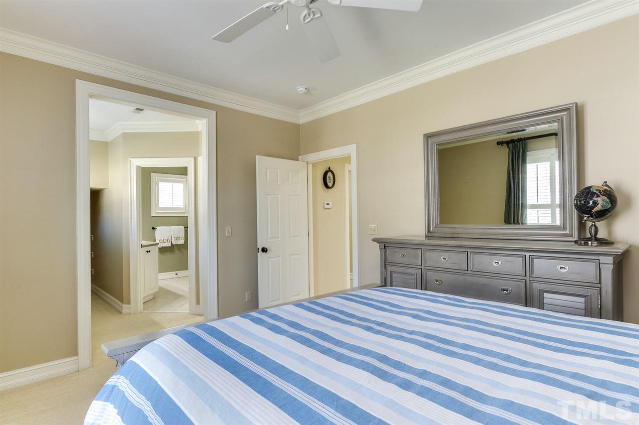 3329 Harden Road Raleigh, NC 27607 - Photo 23 of 29 a bedroom with a bed and a dresser