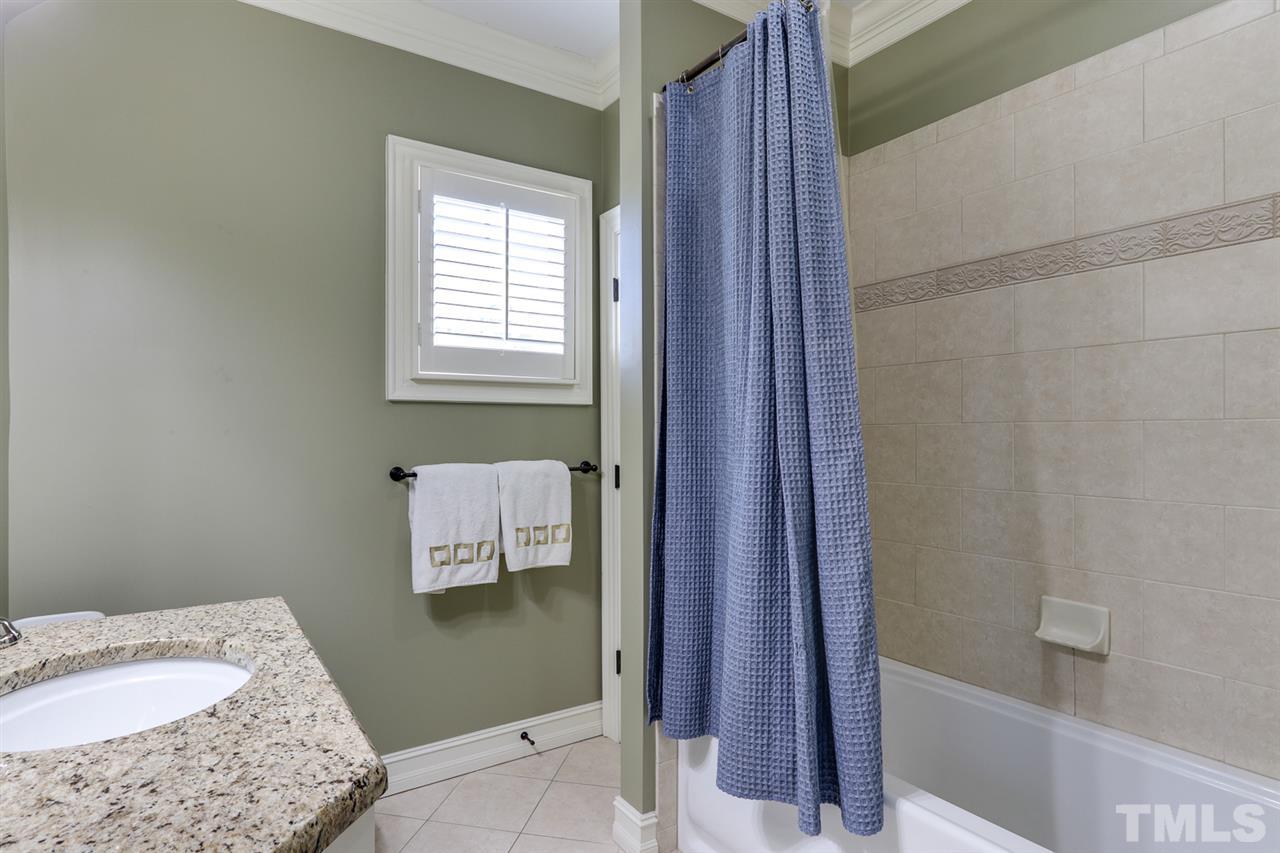 3329 Harden Road Raleigh, NC 27607 - Photo 24 of 29 a bathroom with a sink and a bath tub