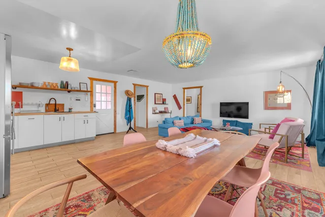 a kitchen with stainless steel appliances a refrigerator and a stove