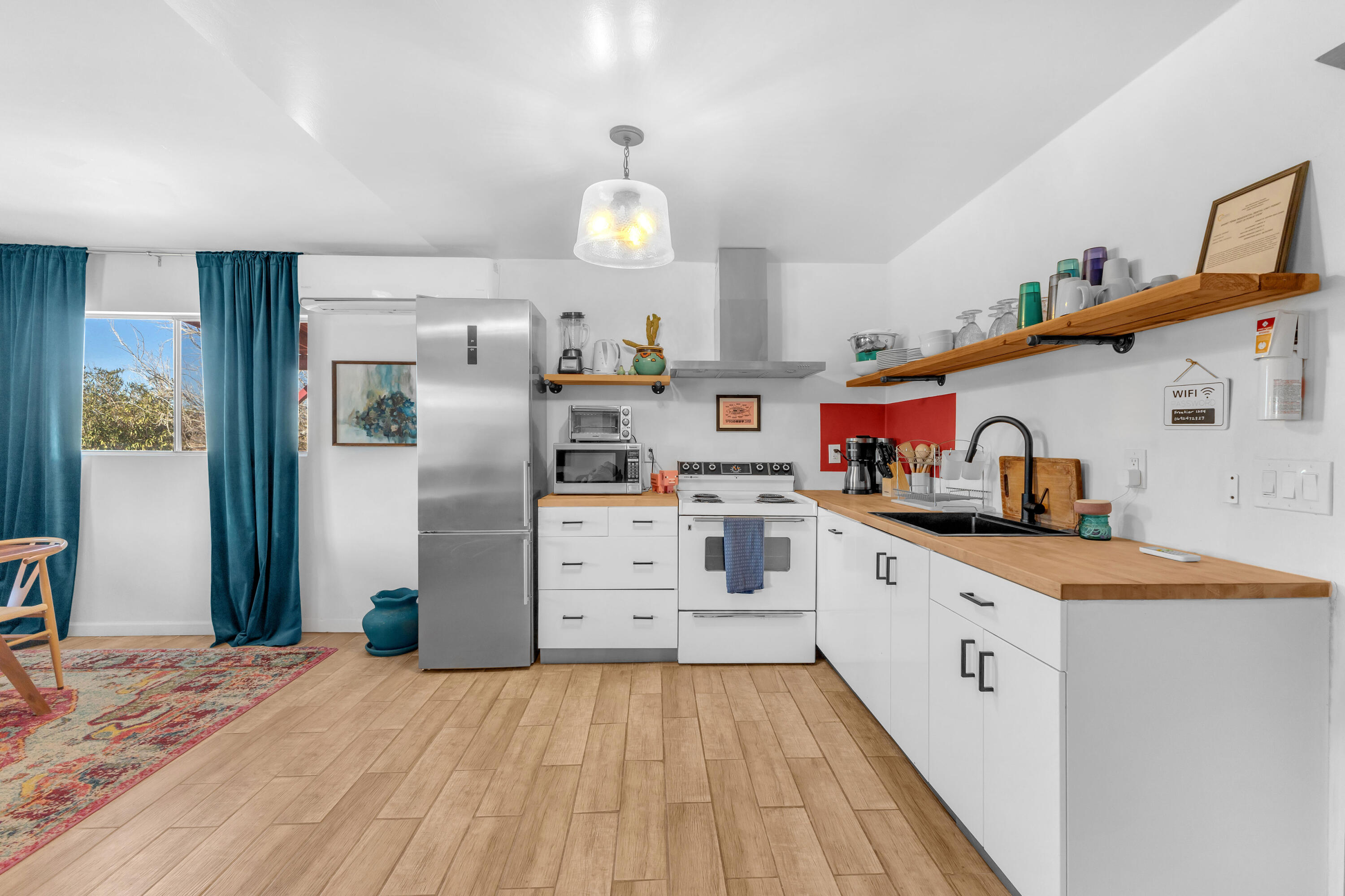 2642 Star Lane Joshua Tree, CA 92252 - Photo 15 of 76 a kitchen with cabinets a sink and appliances