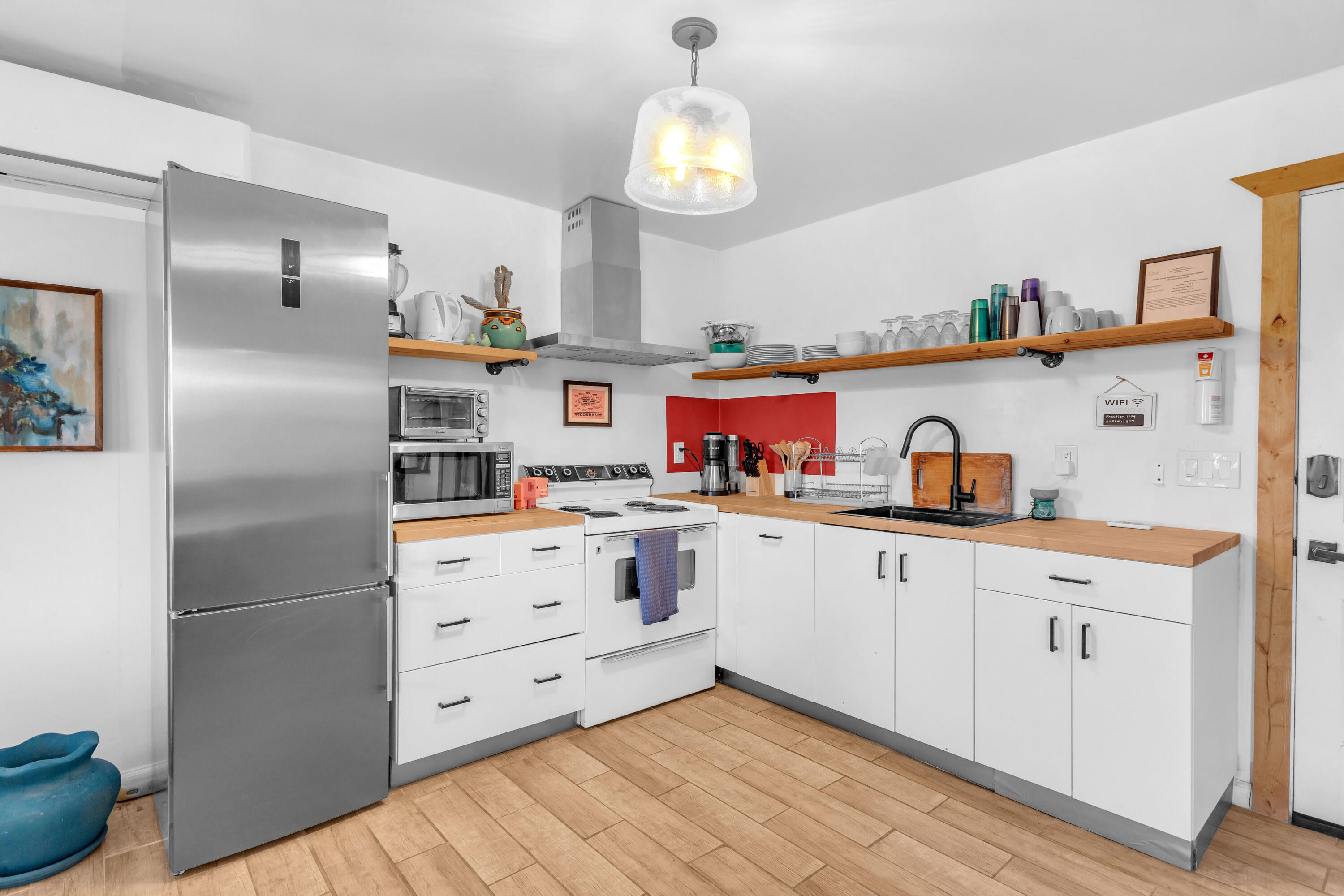 2642 Star Lane Joshua Tree, CA 92252 - Photo 16 of 76 a kitchen with stainless steel appliances a refrigerator and a stove
