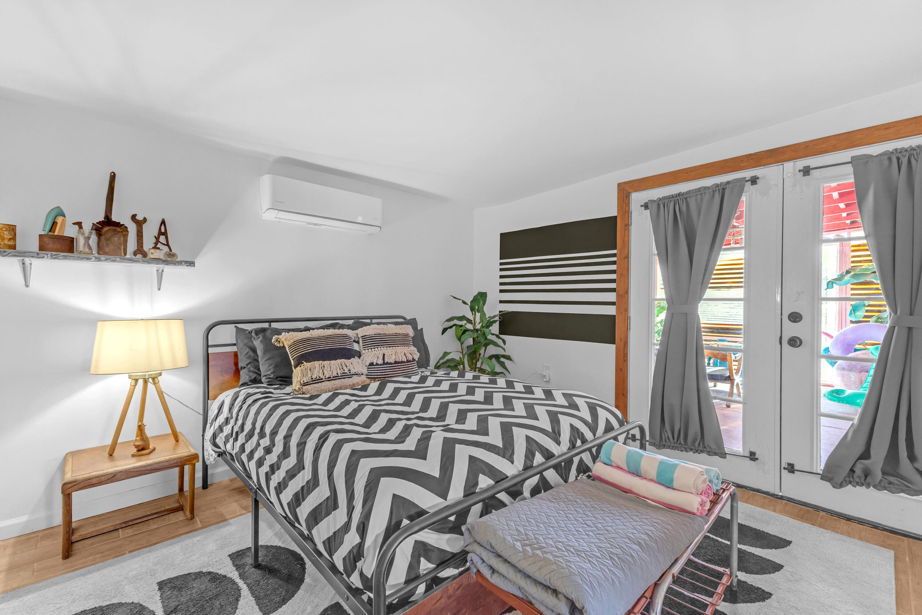 2642 Star Lane Joshua Tree, CA 92252 - Photo 23 of 76 a bedroom with a bed and wooden floor