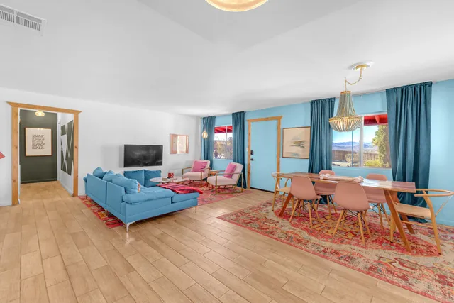 a dining room with furniture and window