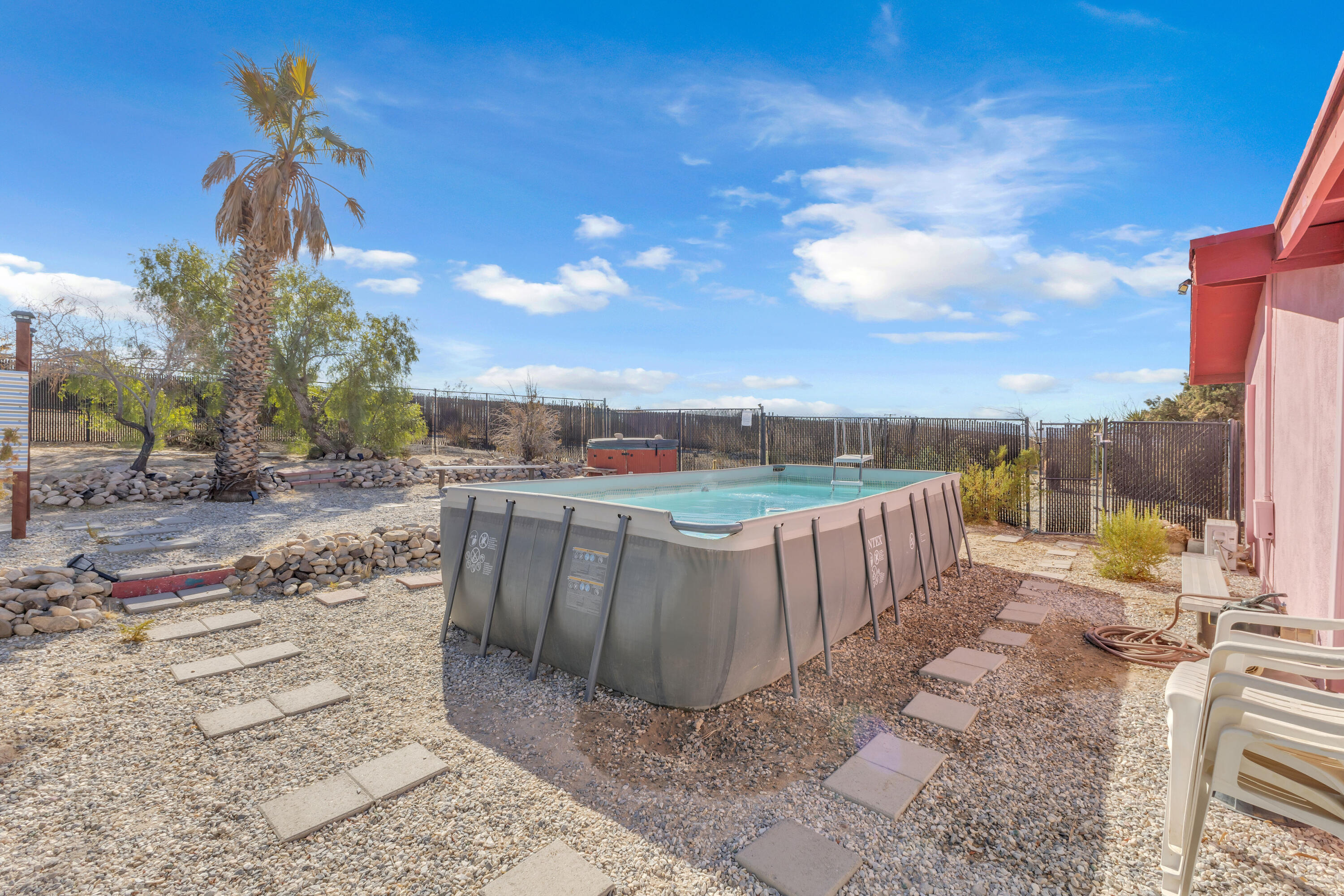 2642 Star Lane Joshua Tree, CA 92252 - Photo 39 of 76 a view of a pathway with a wrought fence