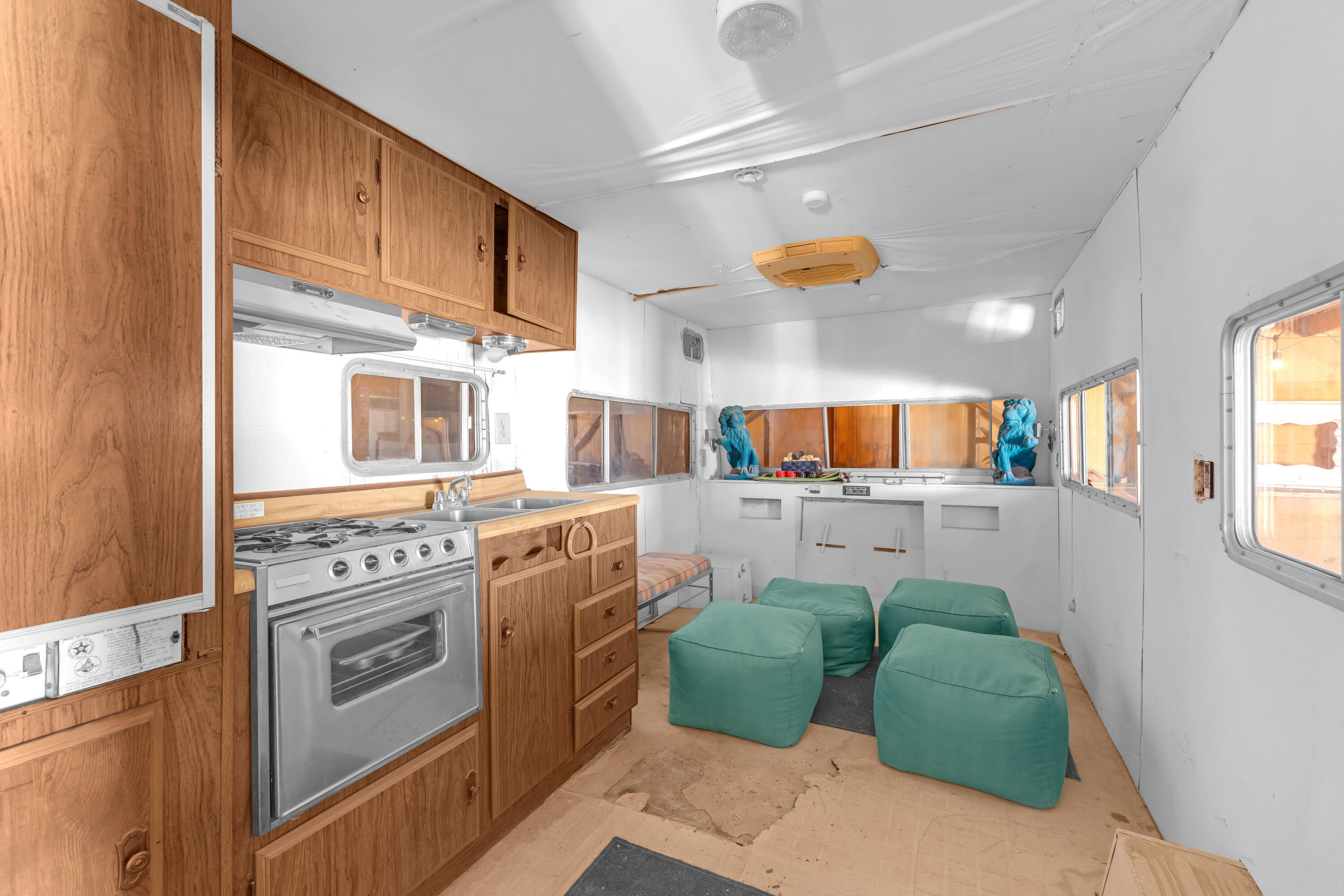 2642 Star Lane Joshua Tree, CA 92252 - Photo 63 of 76 a kitchen with stainless steel appliances kitchen island granite countertop a stove a sink and a refrigerator