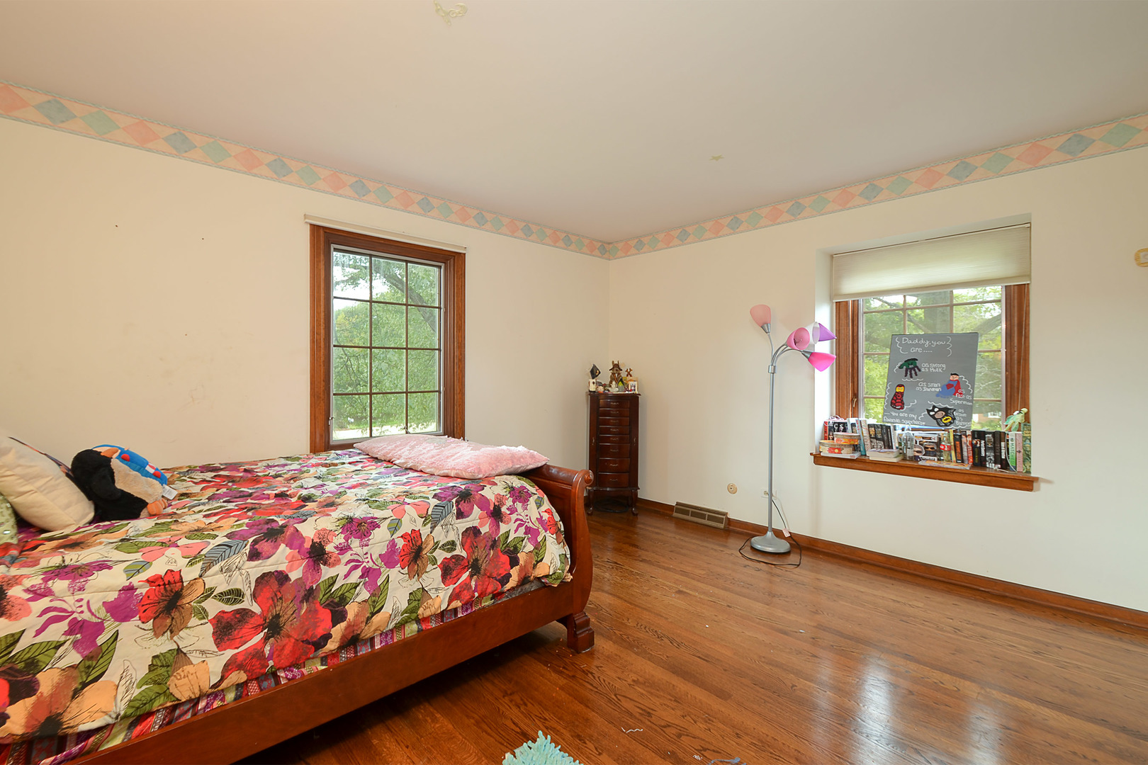 1455 Appleby Road Inverness, IL 60067 - Photo 12 of 16 a bedroom with a bed and wooden floor
