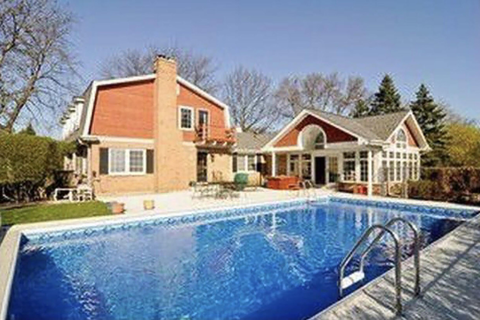 1455 Appleby Road Inverness, IL 60067 - Photo 16 of 16 a front view of house with yard and trees in the background