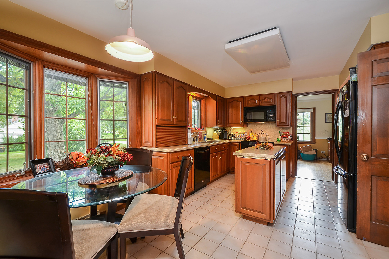 1455 Appleby Road Inverness, IL 60067 - Photo 9 of 16 a room with stainless steel appliances kitchen island granite countertop furniture and a large window