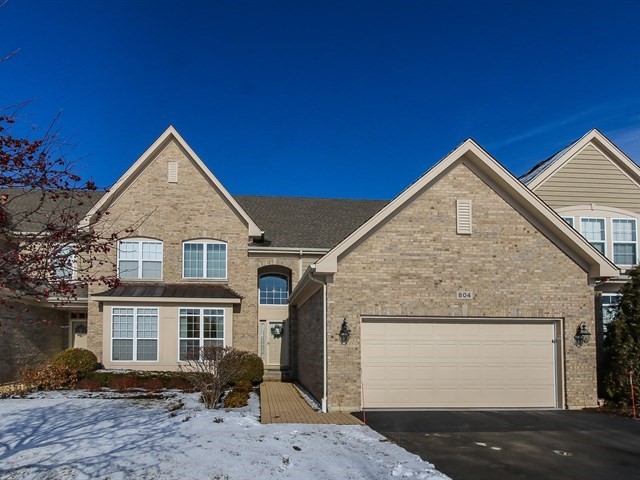 804 Stone Canyon Circle Inverness, IL 60010 - Photo 1 of 30 a front view of a house with garden