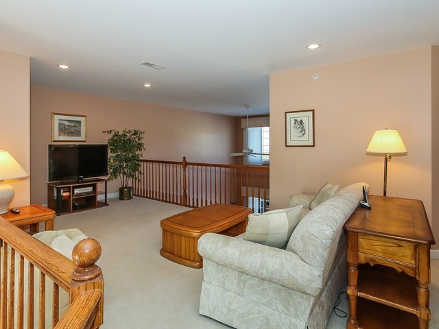 804 Stone Canyon Circle Inverness, IL 60010 - Photo 19 of 30 a living room with furniture and a flat screen tv