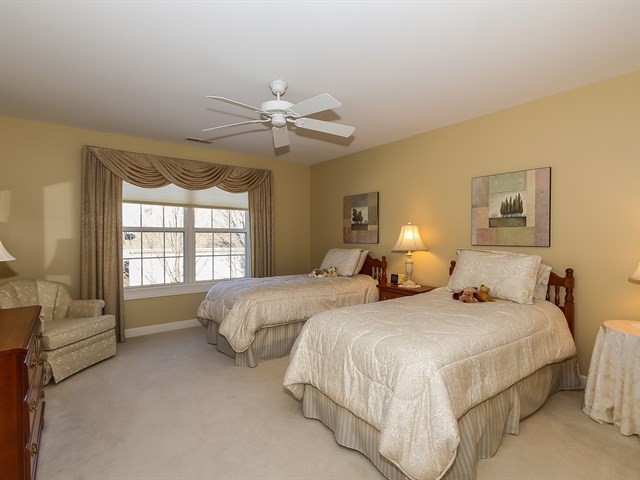 804 Stone Canyon Circle Inverness, IL 60010 - Photo 22 of 30 a spacious bedroom with two bed and a window