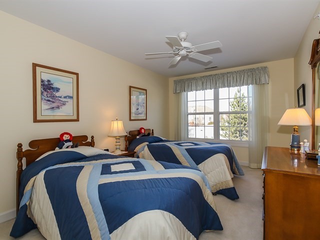 804 Stone Canyon Circle Inverness, IL 60010 - Photo 25 of 30 a bedroom with two beds and a large window