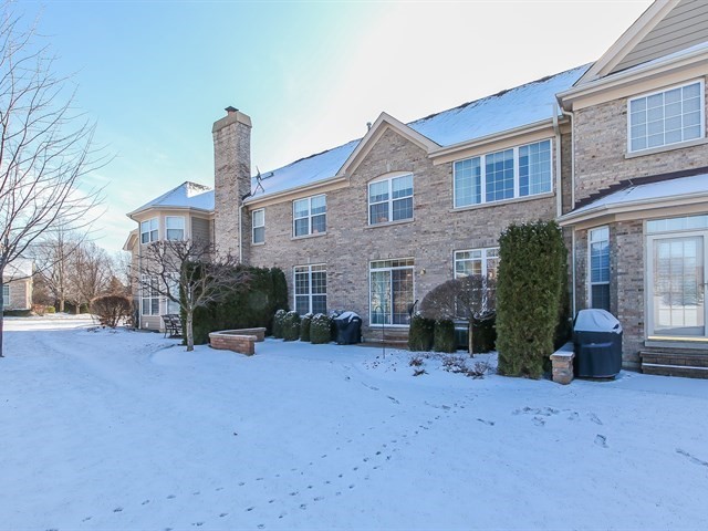 804 Stone Canyon Circle Inverness, IL 60010 - Photo 27 of 30 a front view of a house with a yard and garage