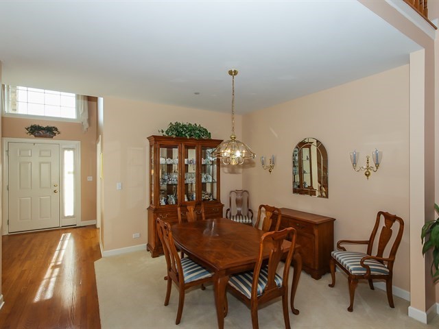 804 Stone Canyon Circle Inverness, IL 60010 - Photo 5 of 30 a dining room with furniture and window