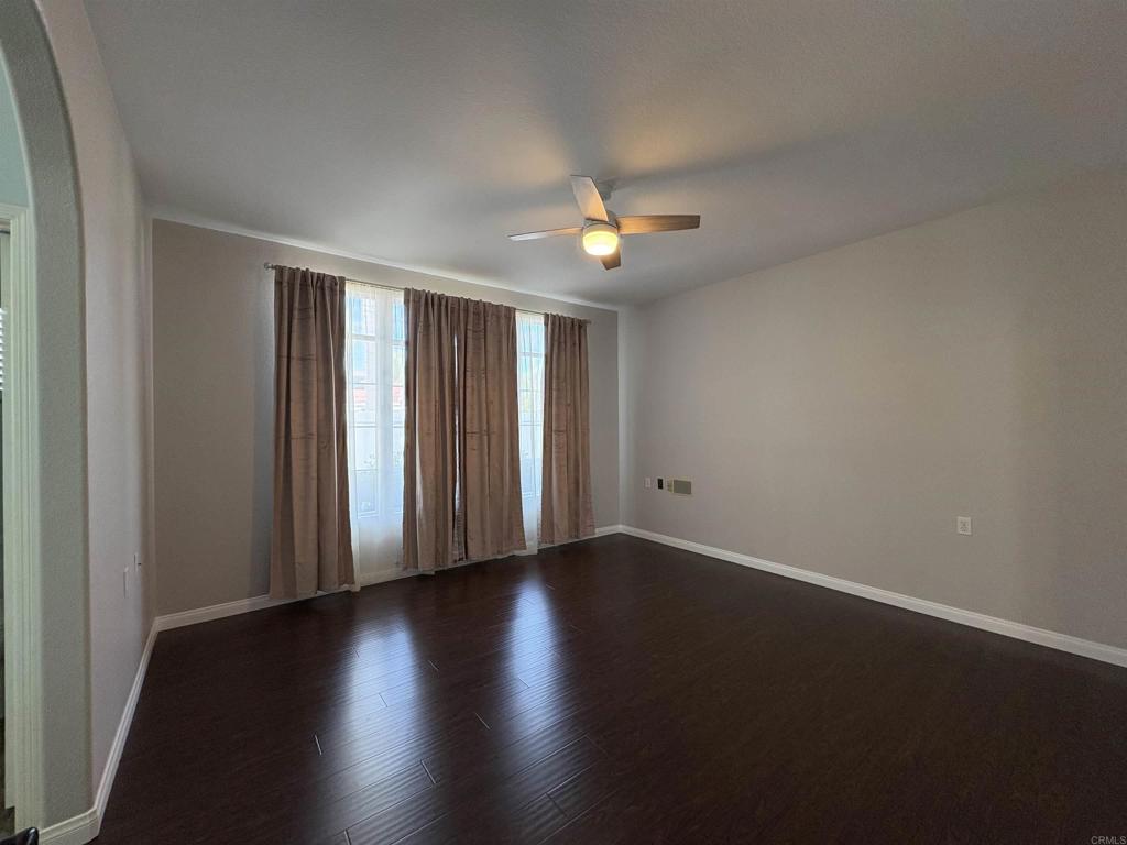 3365 Genoa Way, Unit 138 Oceanside, CA 92056 - Photo 18 of 34 wooden floor in an empty room with a window