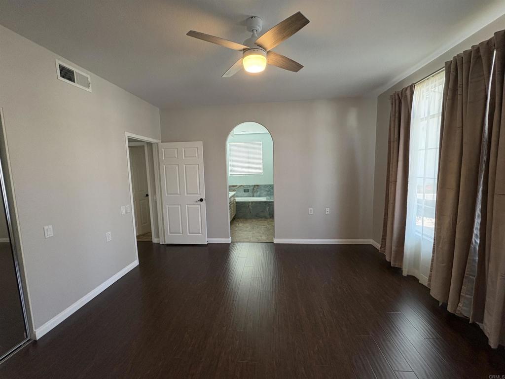 3365 Genoa Way, Unit 138 Oceanside, CA 92056 - Photo 20 of 34 wooden floor in an empty room with a window