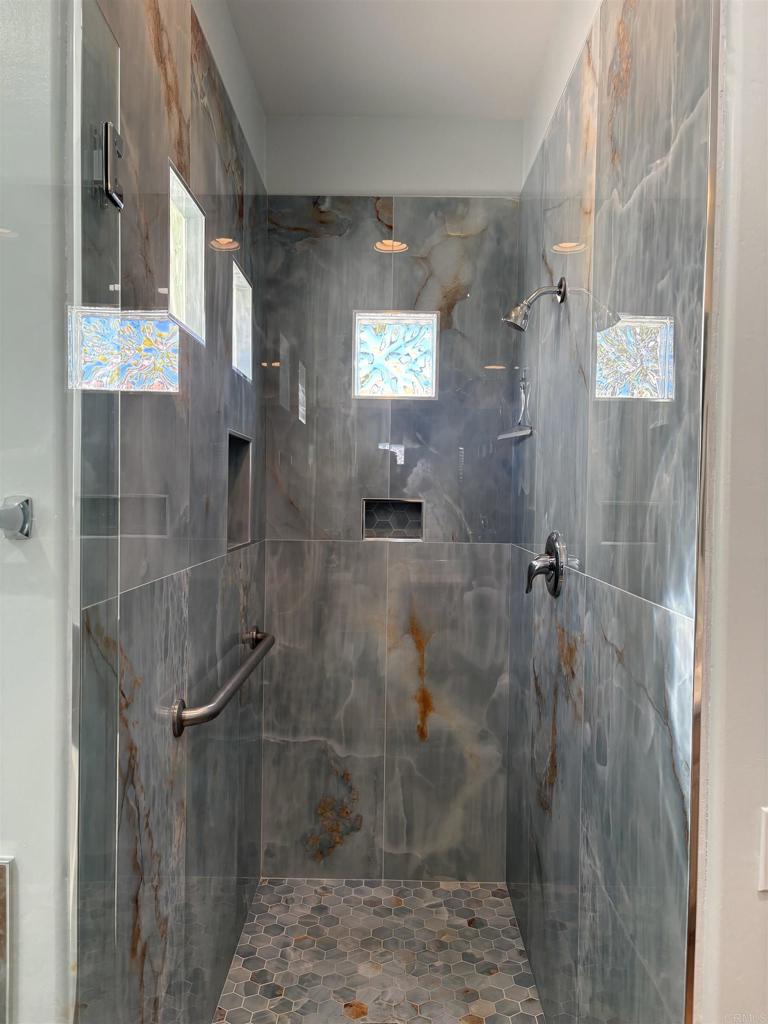 3365 Genoa Way, Unit 138 Oceanside, CA 92056 - Photo 22 of 34 a bathroom with a shower