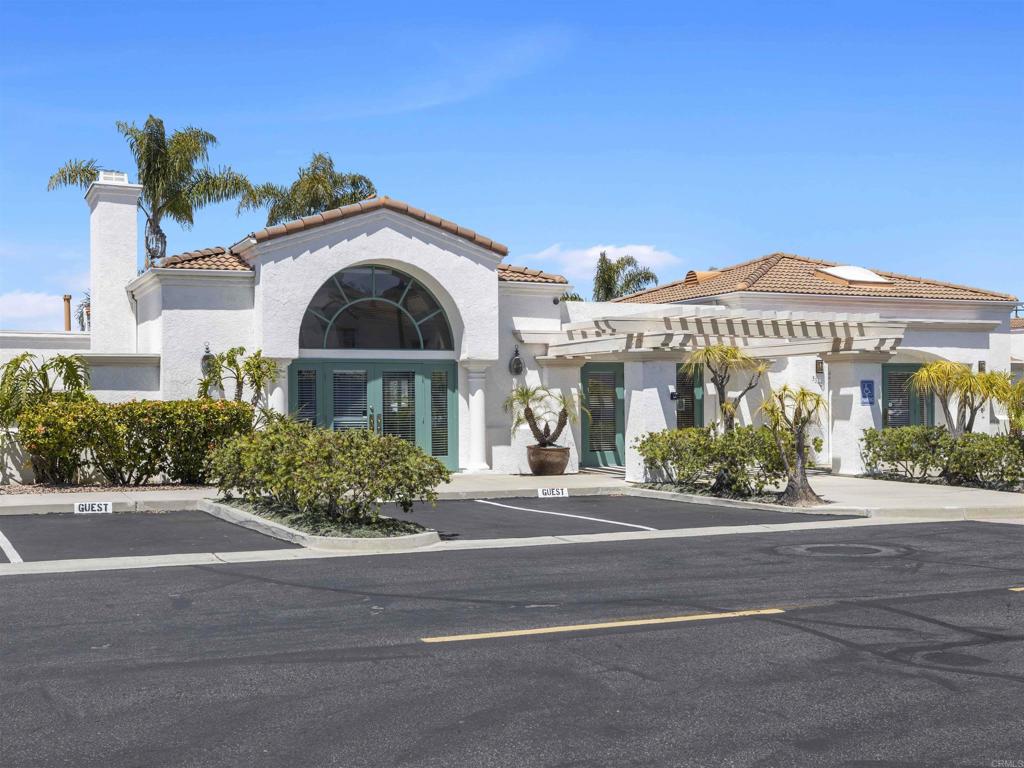 3365 Genoa Way, Unit 138 Oceanside, CA 92056 - Photo 28 of 34 a front view of a house with a garden