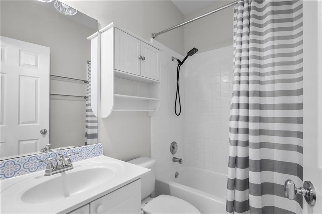 3675 Peachtree Road Northeast, Unit 45 Atlanta, GA 30319 - Photo 20 of 42 a bathroom with a sink toilet and shower