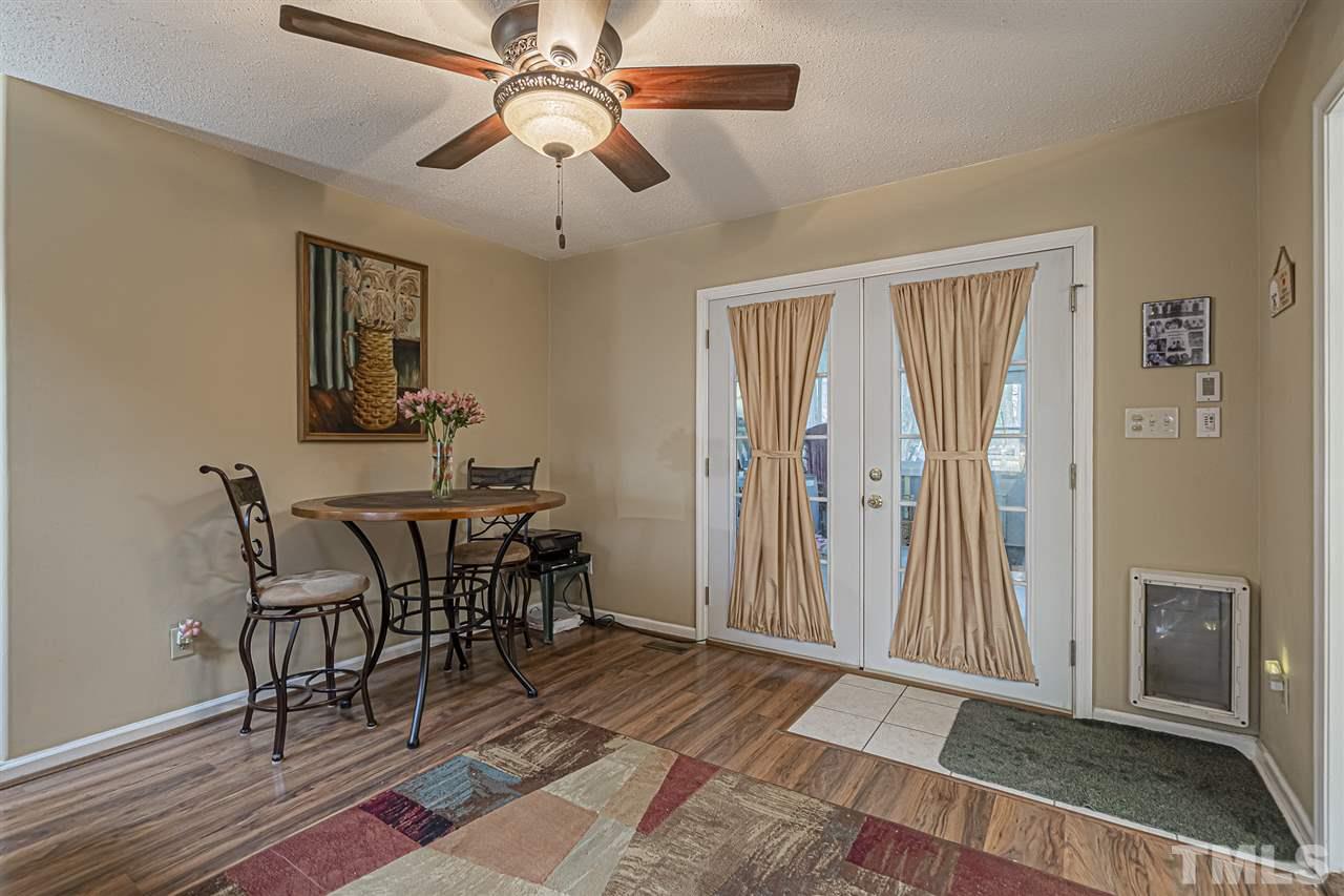 4248 Birmingham Way Raleigh, NC 27604 - Photo 11 of 29 a view of a dining room with furniture and chandelier
