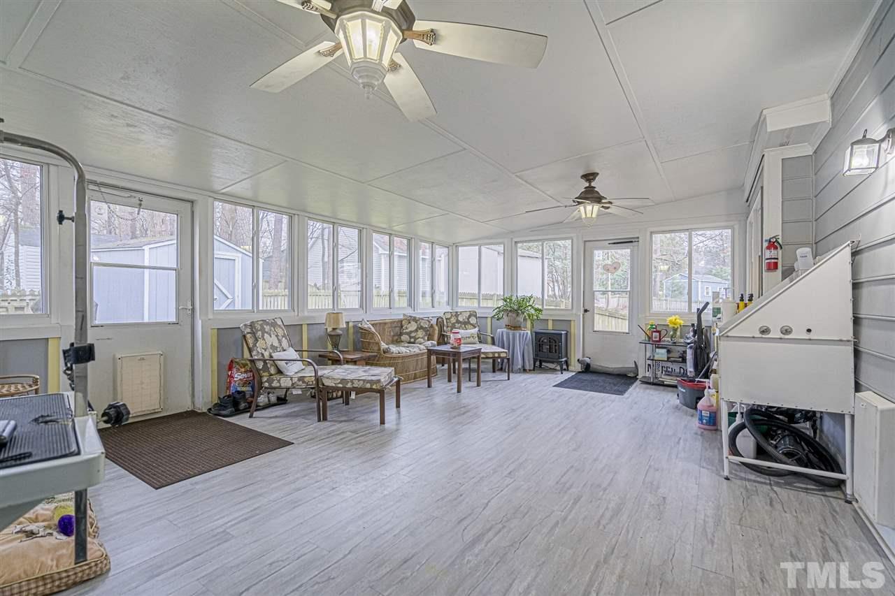 4248 Birmingham Way Raleigh, NC 27604 - Photo 25 of 29 a living room with furniture and wooden floor