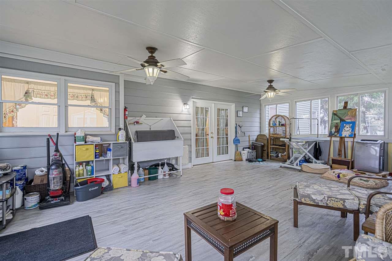4248 Birmingham Way Raleigh, NC 27604 - Photo 26 of 29 a living room with furniture and a wooden floor