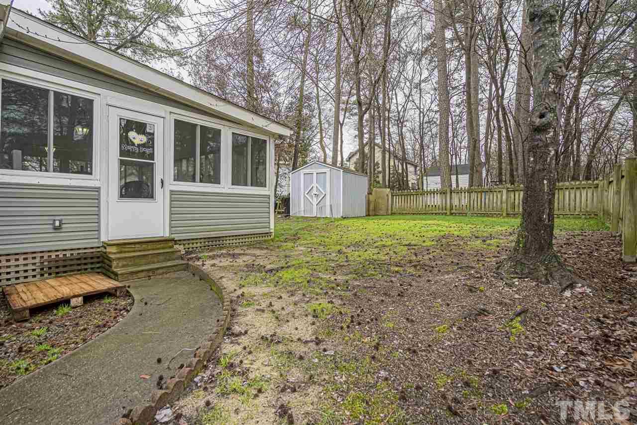 4248 Birmingham Way Raleigh, NC 27604 - Photo 28 of 29 a view of a house with a yard and tree s