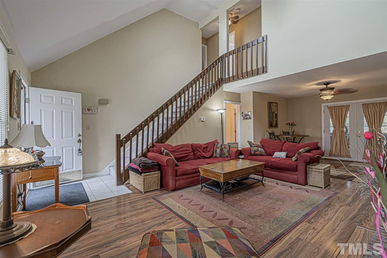 4248 Birmingham Way Raleigh, NC 27604 - Photo 7 of 29 a living room with furniture or couch and a table