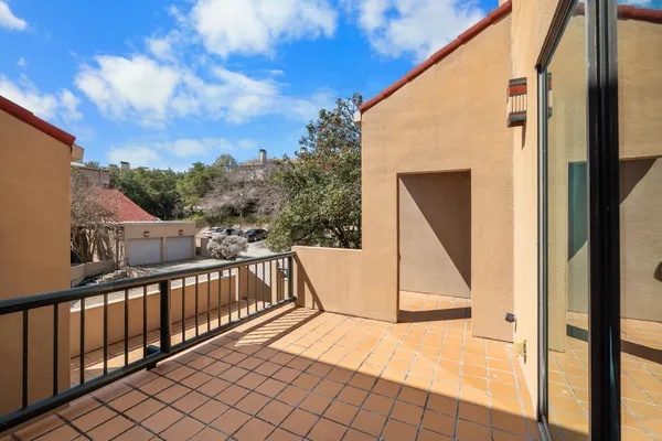 a view of a balcony with staircase
