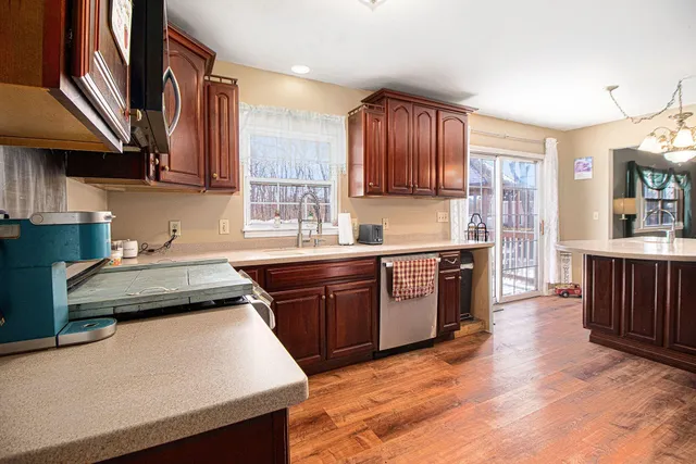 a kitchen with a stove a sink and a refrigerator