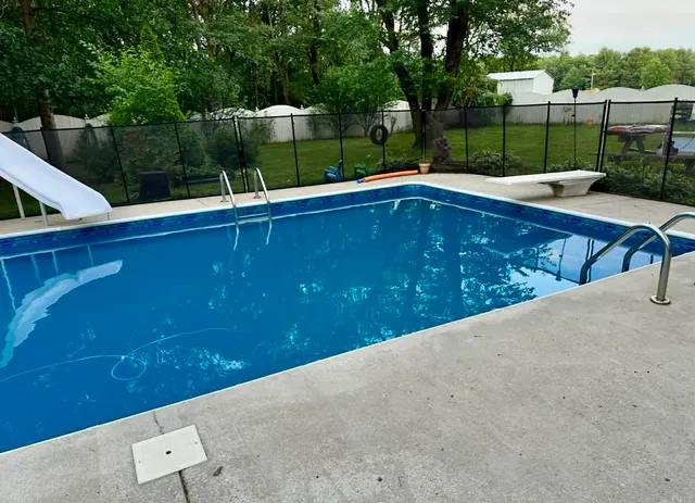 a backyard of a house with a lot of flowers