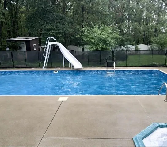 a backyard of a house with outdoor seating
