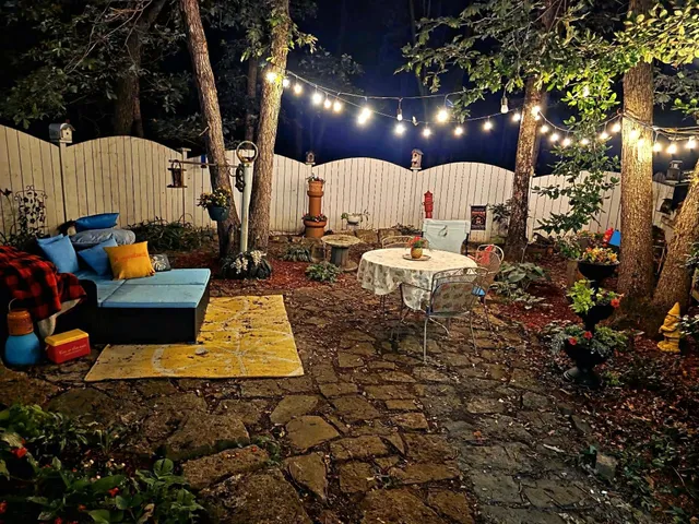 a view of a patio with table and chairs with wooden floor