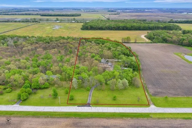 a house that has a tree in front of it
