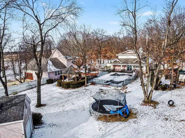 an aerial view of residential house with outdoor space and street view