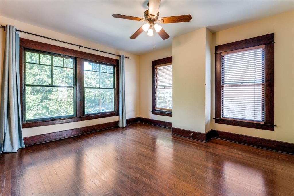 5102 Reiger Avenue Dallas, TX 75214 - Photo 15 of 18 a view of an empty room with wooden floor and a window