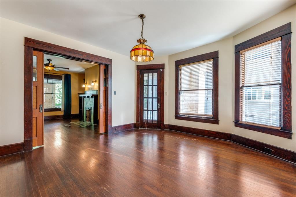 5102 Reiger Avenue Dallas, TX 75214 - Photo 4 of 18 a view of an empty room with wooden floor and a window