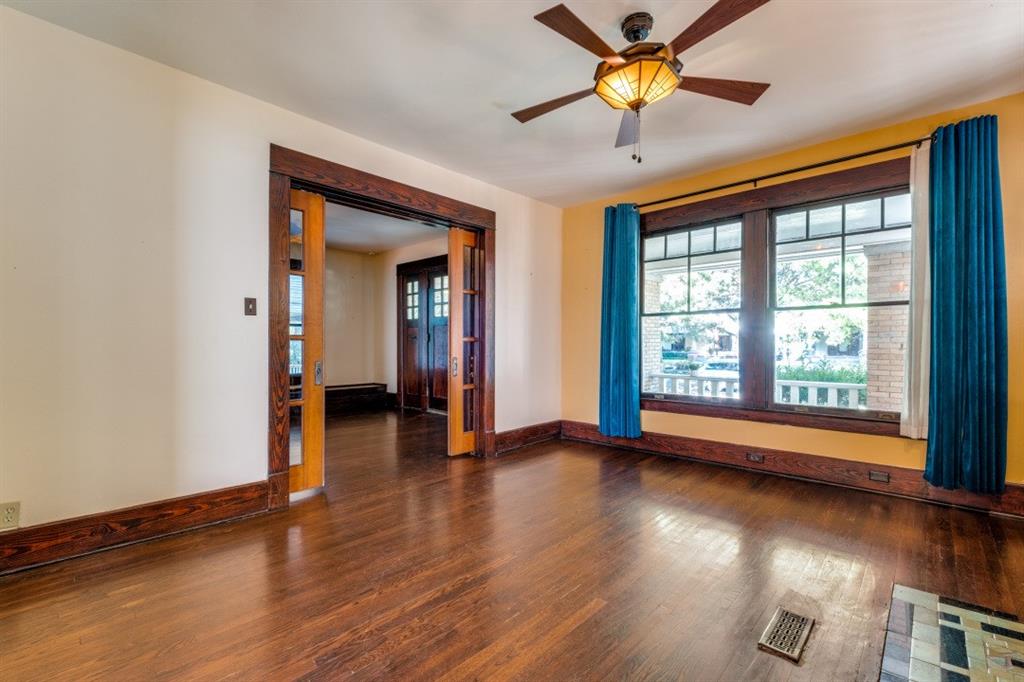 5102 Reiger Avenue Dallas, TX 75214 - Photo 5 of 18 wooden floor in an empty room with a window