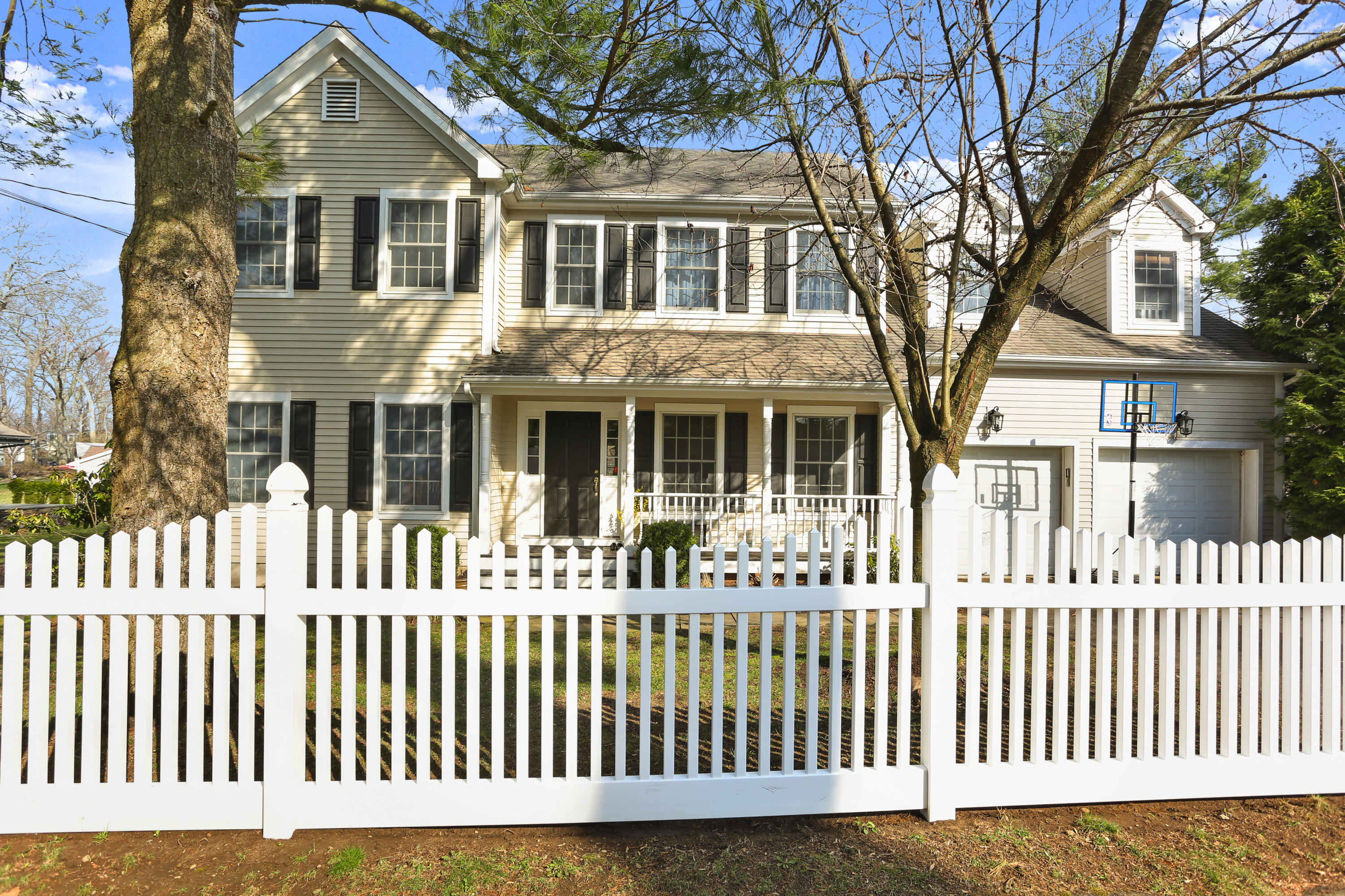 2 Old Field Road Norwalk, CT 06853 - Photo 2 of 23 a front view of a house with a fence